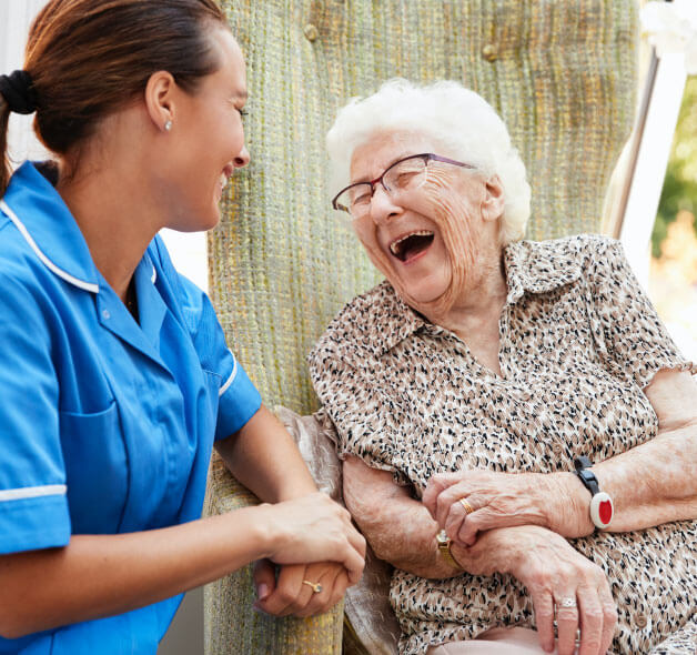 Nurse and patient laughing